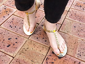 Sexy all-natural feet in gorgeous gold sandals